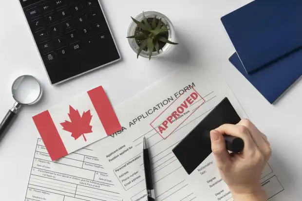 visa-application-composition-with-canadian-flag-scaled.jpg